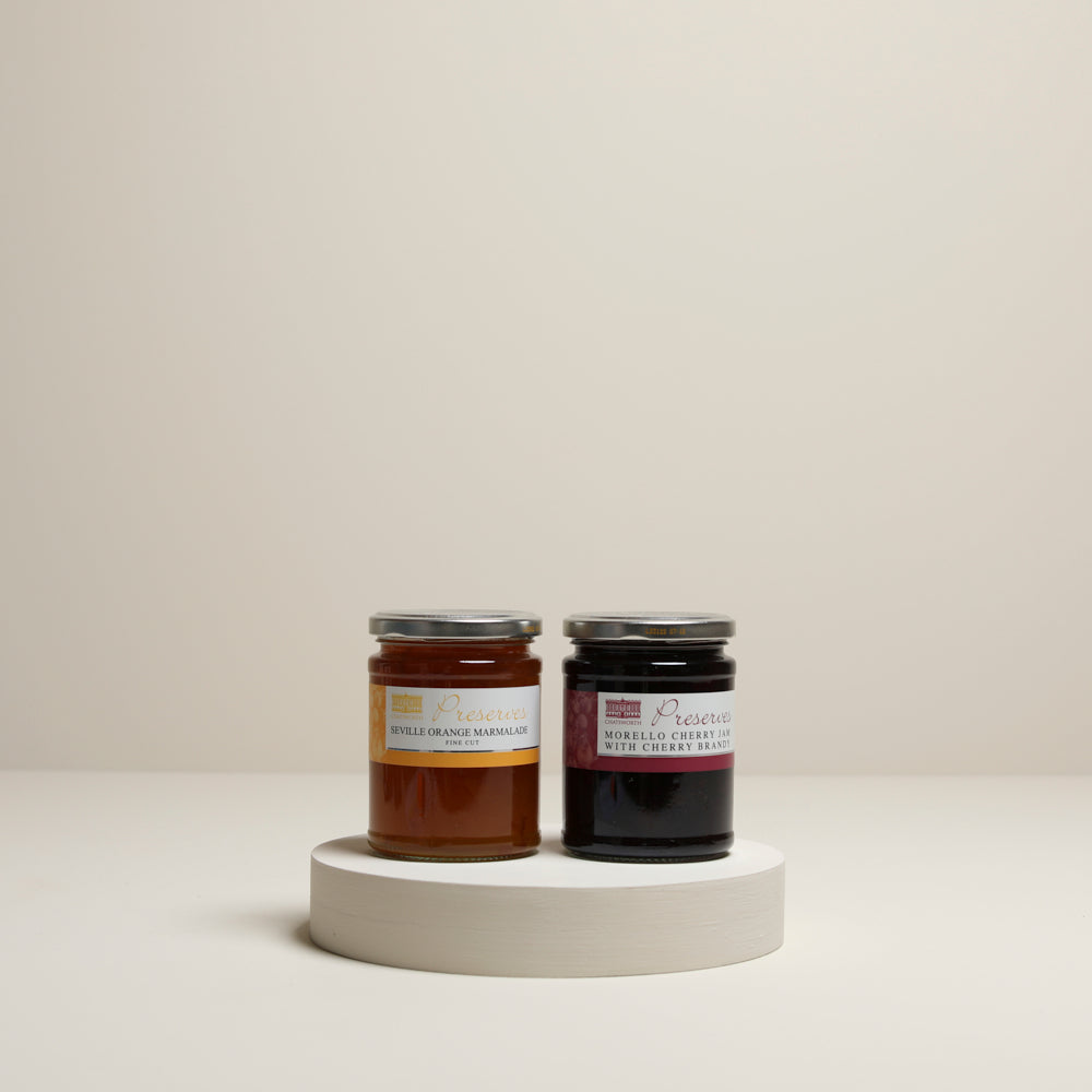 Jars of Seville orange marmalade and Morello cherry jam