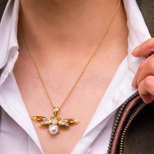 
                  
                    18ct yellow gold, pearl, diamond and enamel moth necklace
                  
                