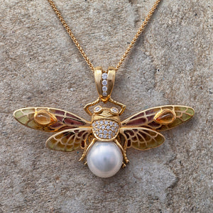 
                  
                    18ct yellow gold, pearl, diamond and enamel moth necklace
                  
                