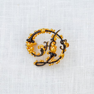 
                  
                    Sterling silver, yellow gold vermeil and rhodium House Style brooch
                  
                